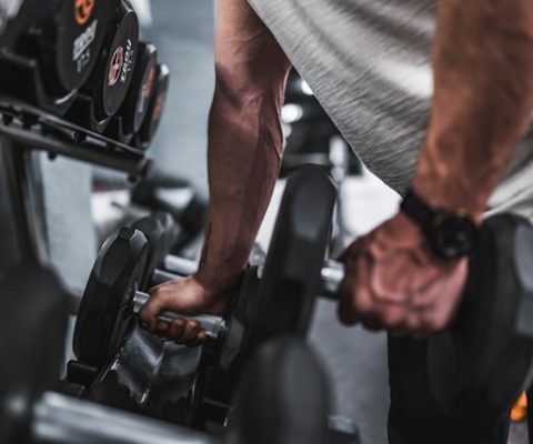 Performing Dumbbell Rows